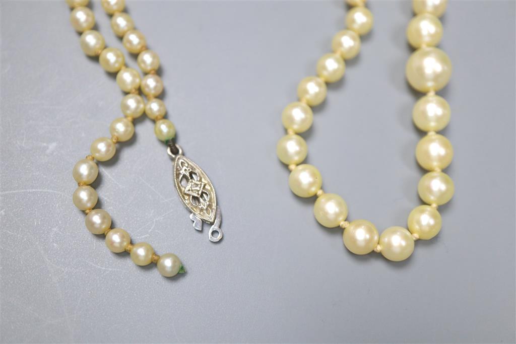 An early 20th? century yellow metal and diamond set ring, gross 7 grams, and 18k ring (a.f.) gross 1.9 grams and a necklace.